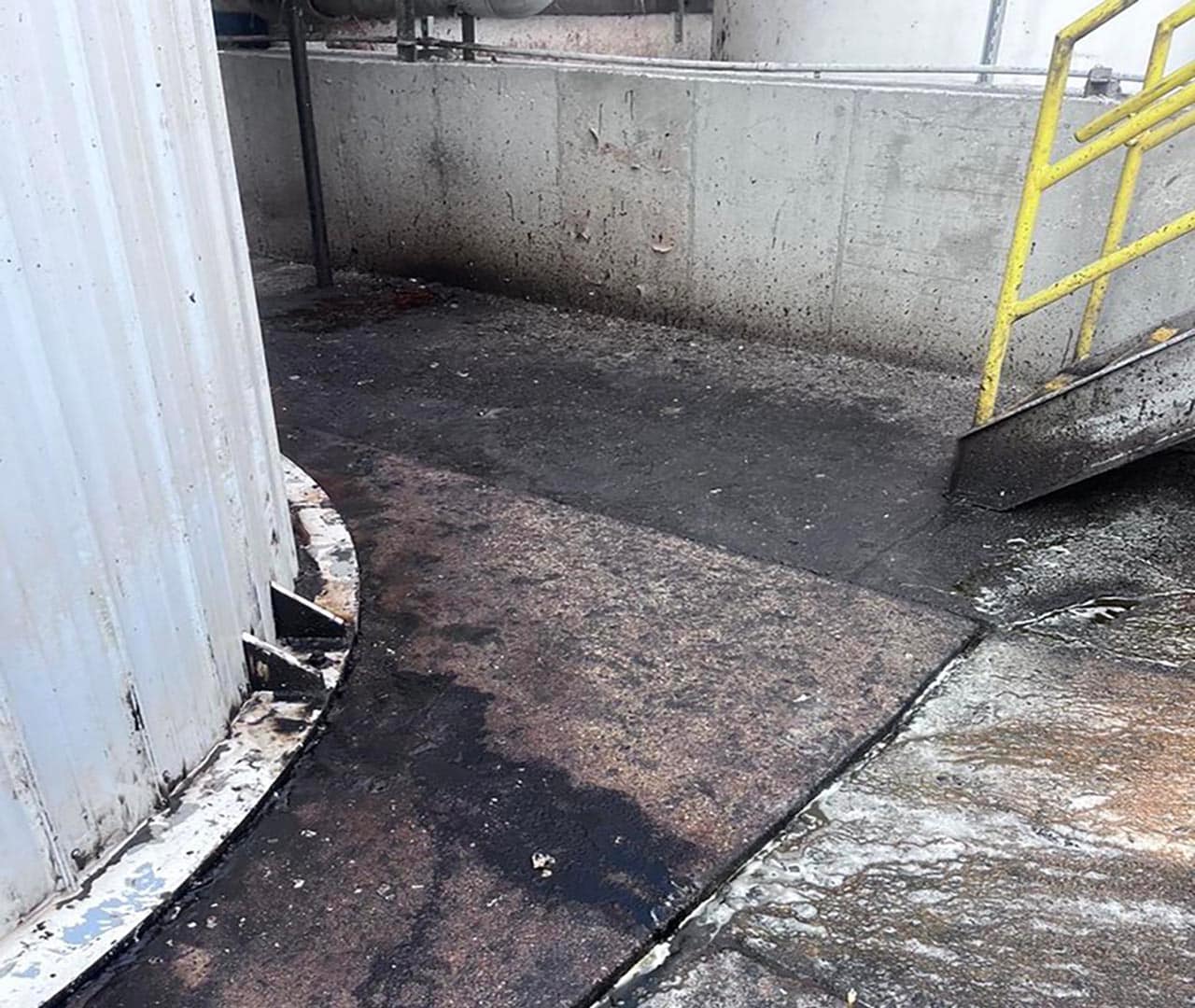 Before pro clean mobile wash power washed this industrial concrete.