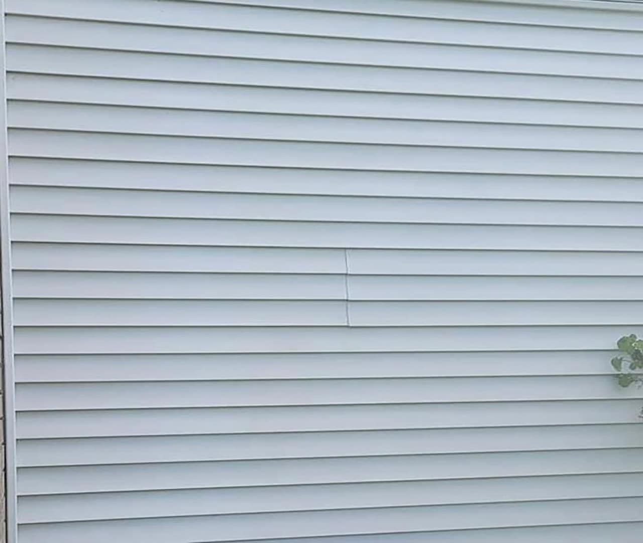 After pro clean mobile wash power washed the siding of this home