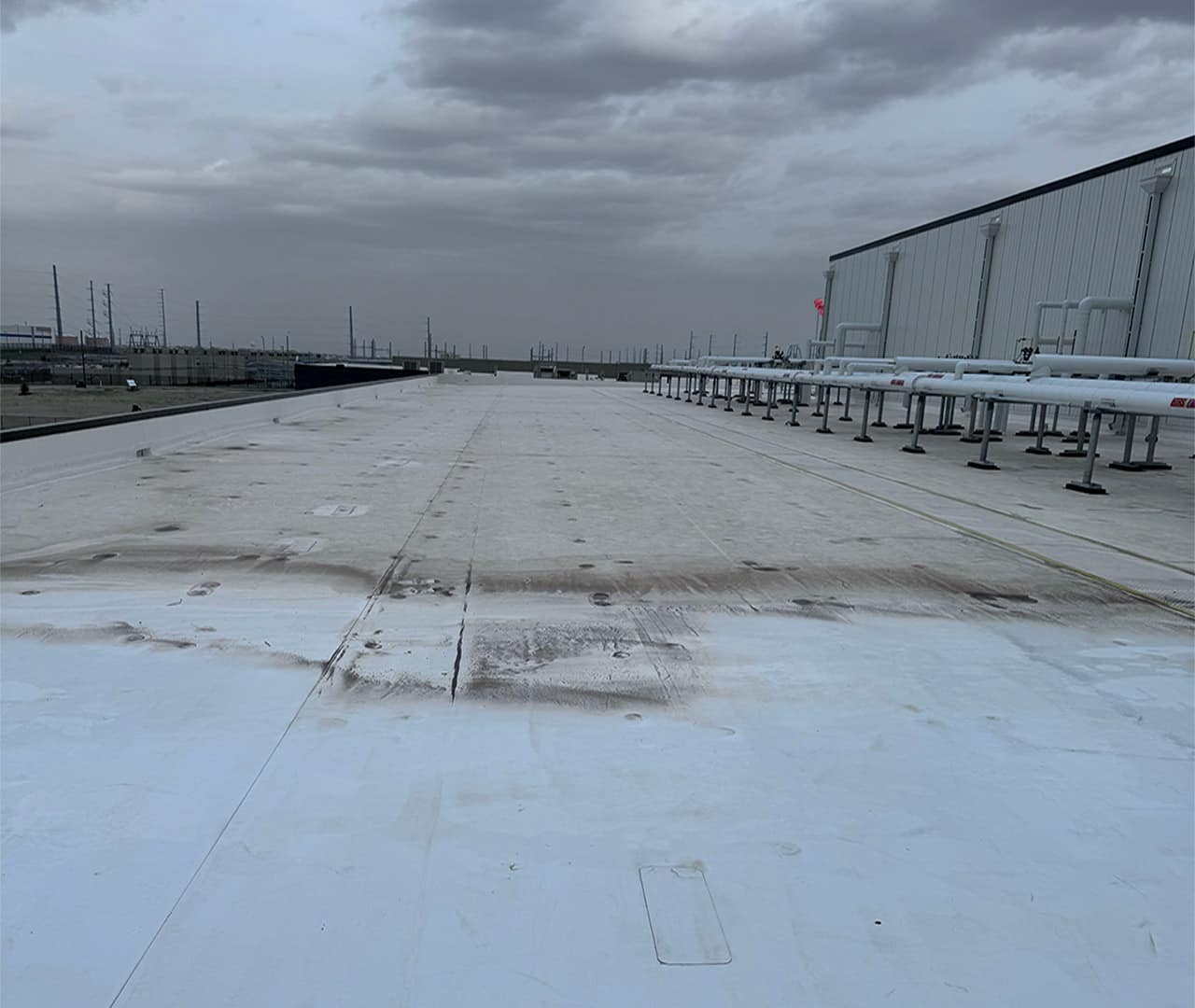 During pro clean mobile wash power washing this industrial roof.