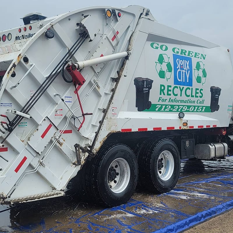 After Pro clean mobile wash power washes a commercial garbage truck.