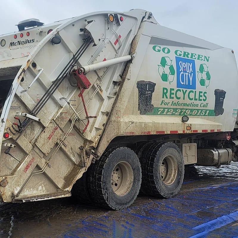 Before Pro clean mobile wash power washes a commercial garbage truck.