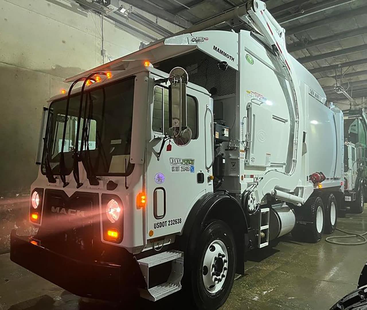 After Pro clean mobile wash power washes a commercial garbage truck.