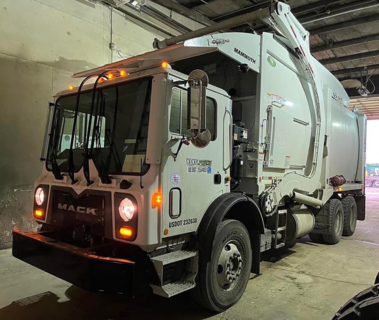 Before Pro clean mobile wash power washes a commercial garbage truck.