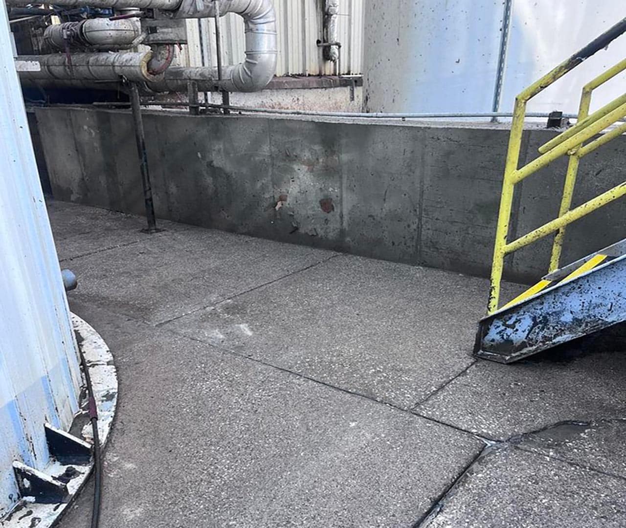 After pro clean mobile wash power washed this industrial concrete.