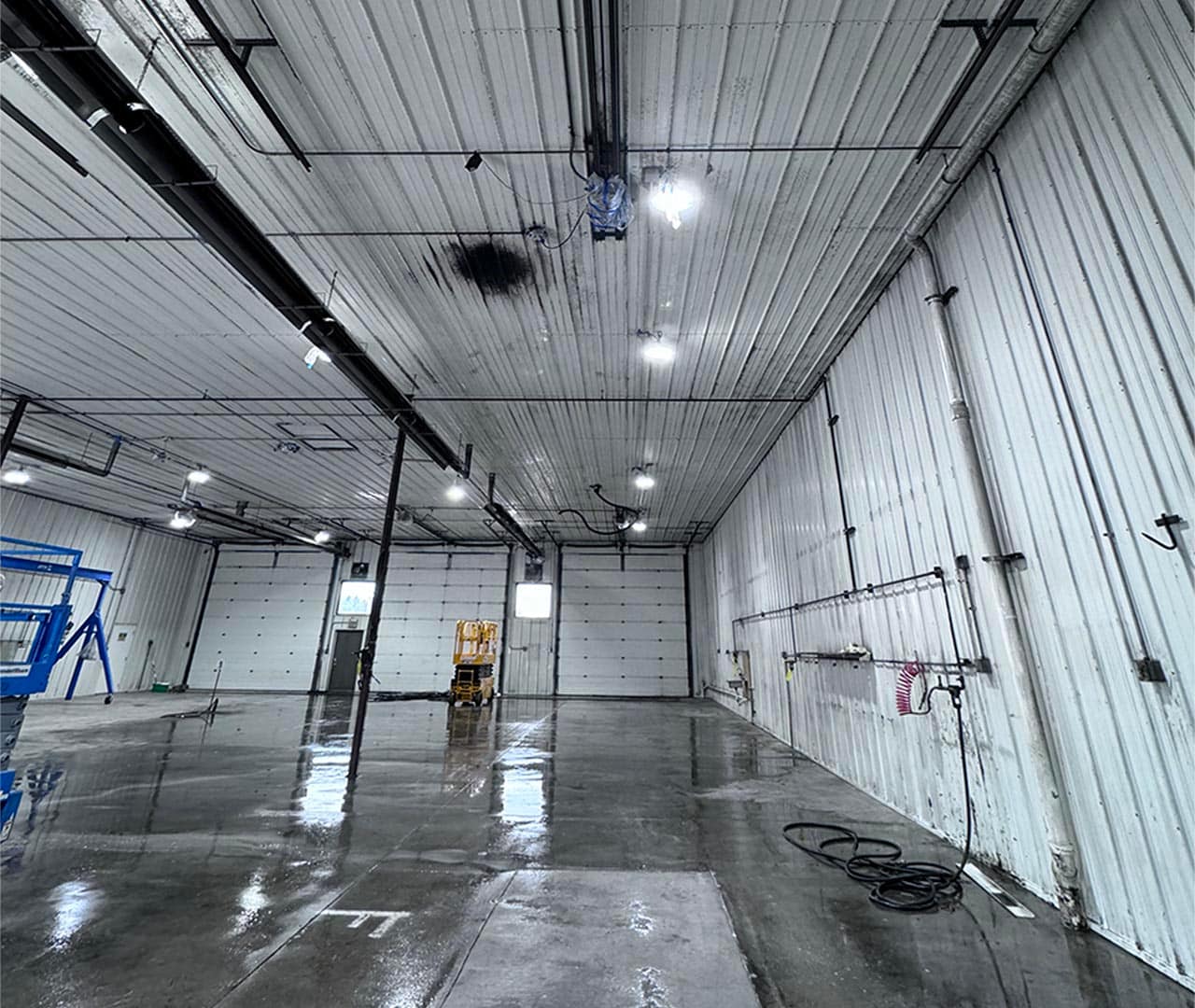 Before pro clean mobile wash power washed this commercial garage.