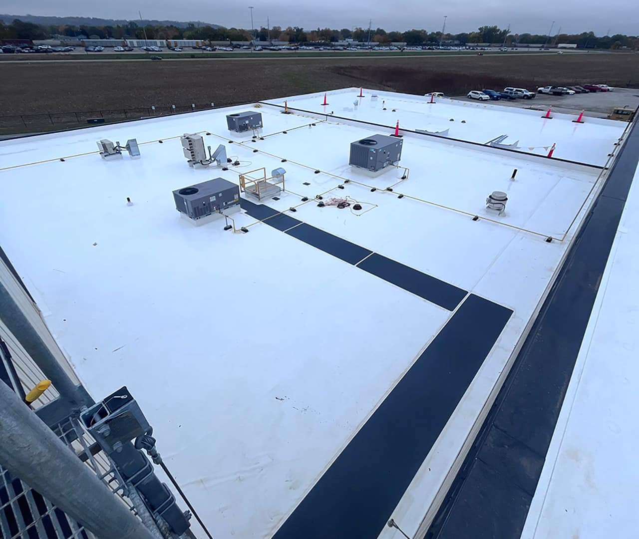 Pro clean mobile wash showing a commercial building roof after being power washed