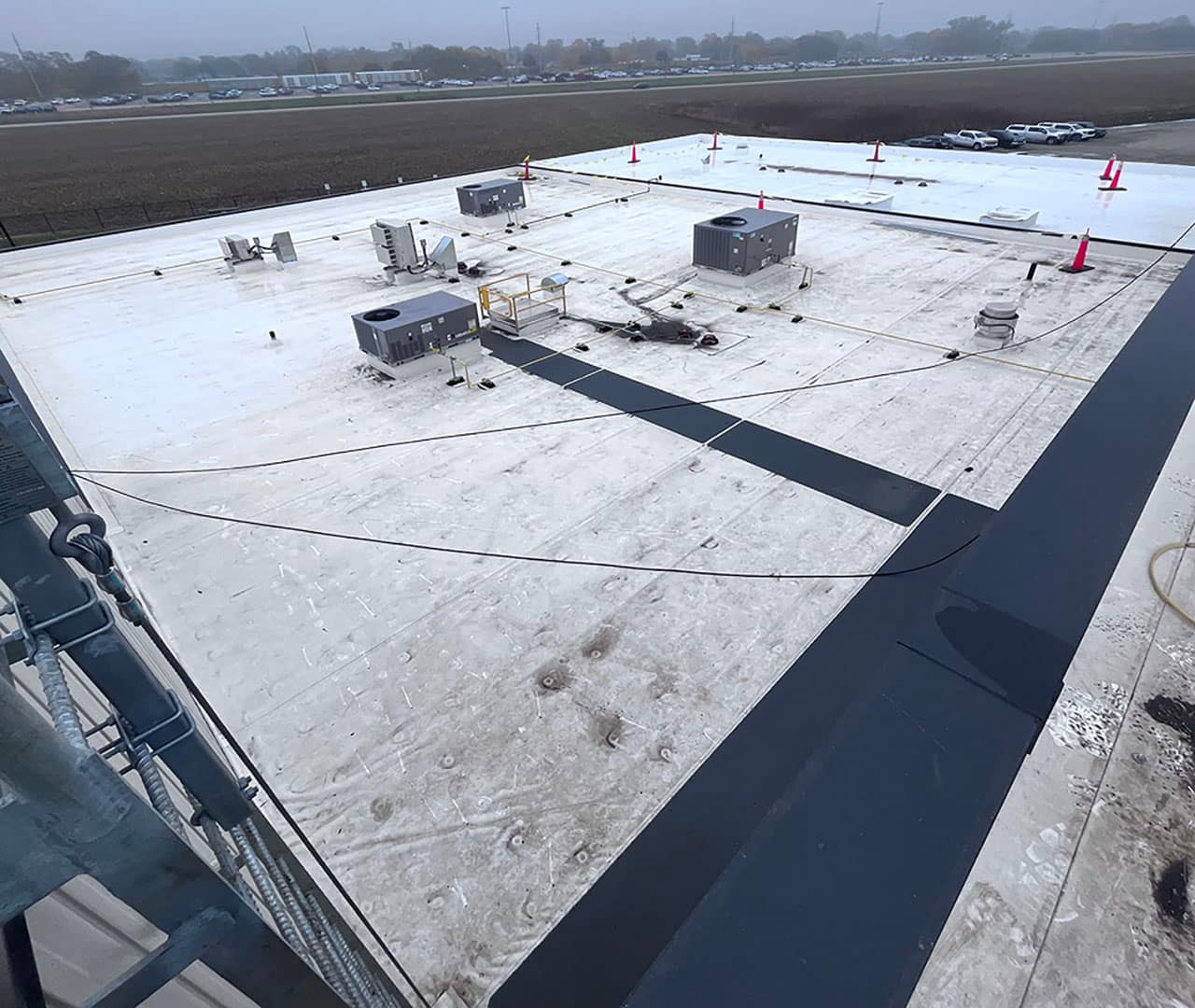 Pro clean mobile wash showing a commercial building roof before being power washed