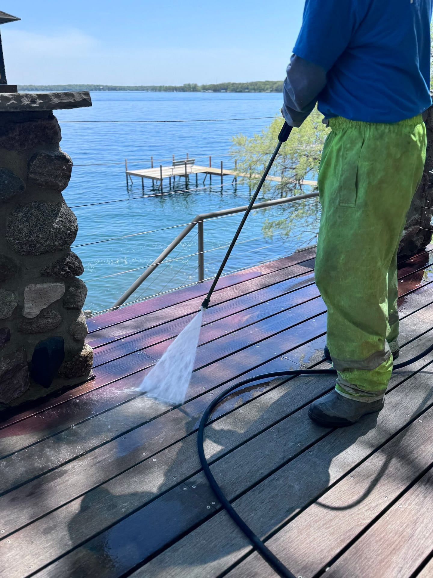IMG_0855 Pro clean mobile wash tech power washing a wood deck at a home on the water